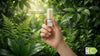 Hand holds an LED bulb amid lush green leaves, highlighting energy efficiency stats: 3.2W=40W, 520lm, 93.6% savings, 30,000h life. Eco-friendly concept.